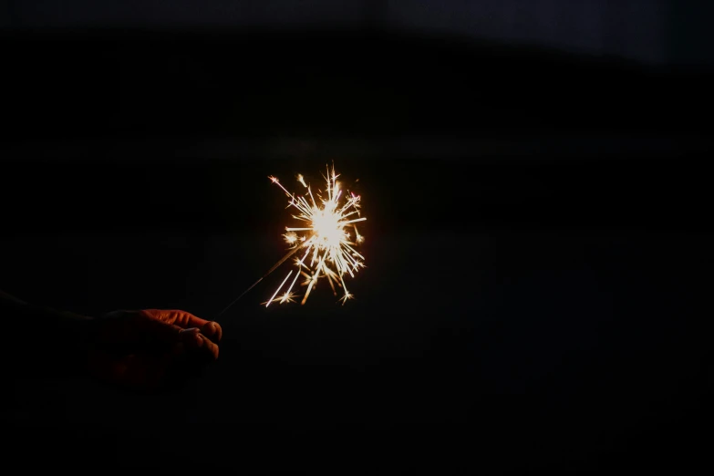 a small fireworks stick coming out from the sky