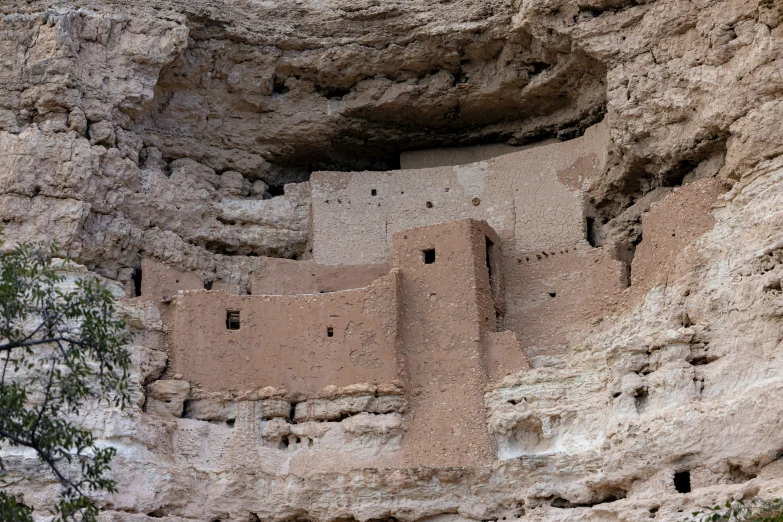 a cliff dwelling in a valley between two sides of it