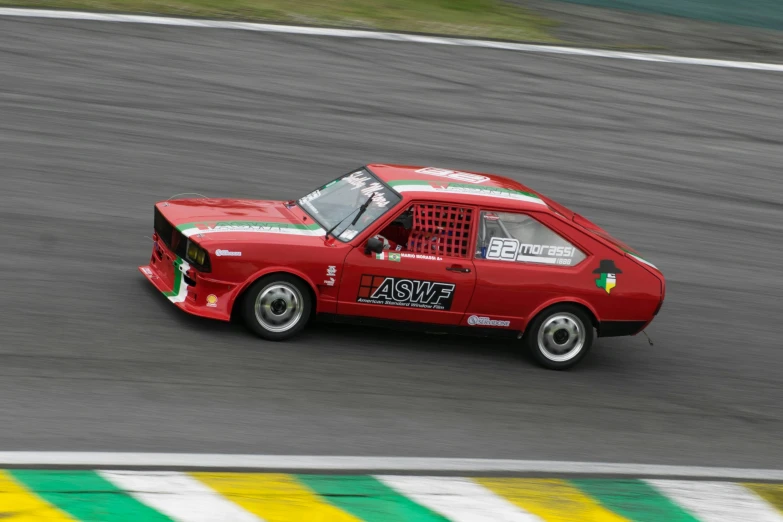 red mini car in motion on the track