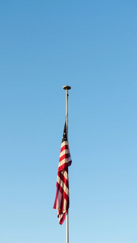 an american flag blowing in the wind