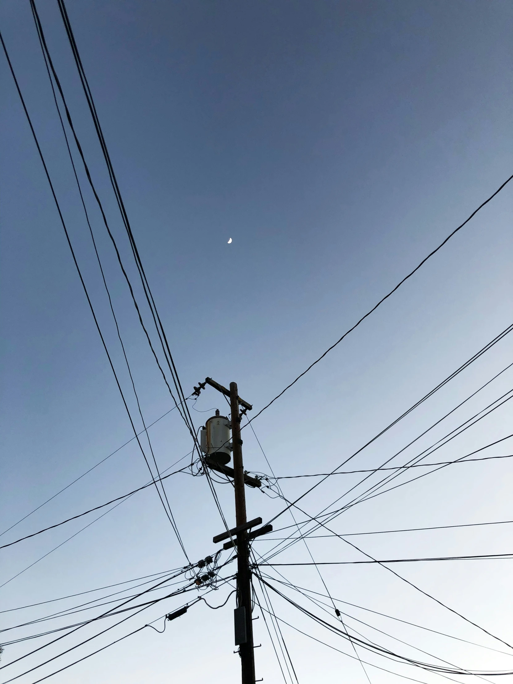 a pole that has many telephone wires on it