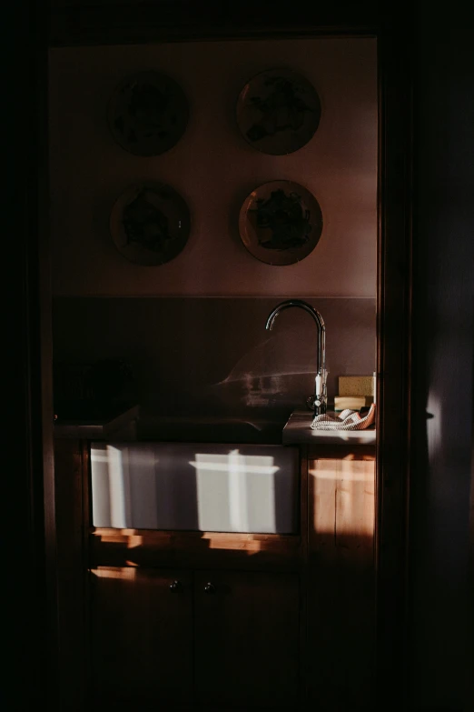 the light reflects off of the sink and counter