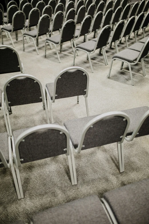 rows of chairs in an empty auditorium