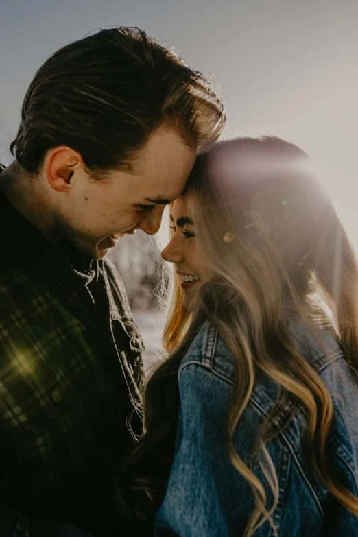 the young man and woman are looking into each others eyes