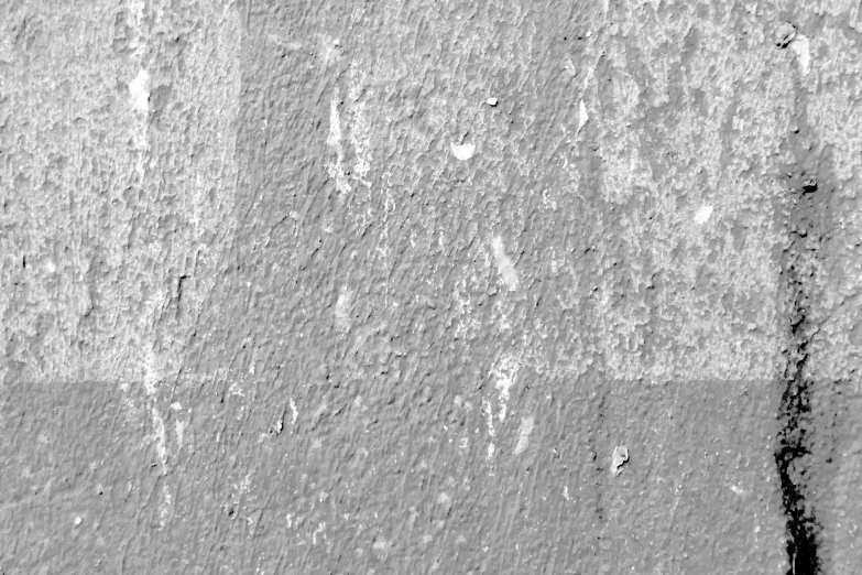 close up view of a cement wall with markings