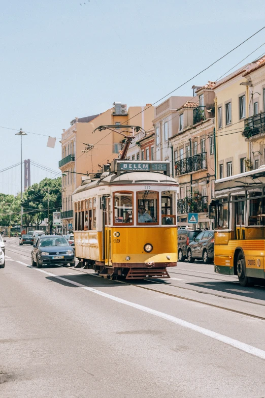 an old streetcar being pulled up the side of a street