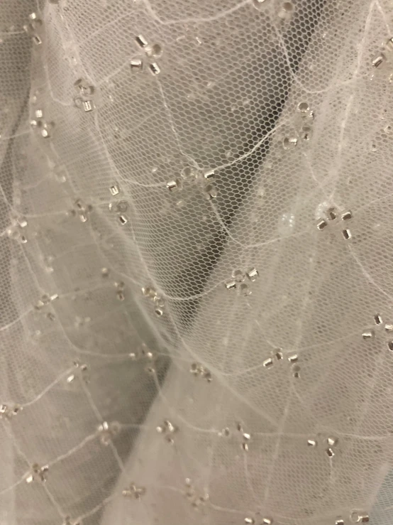 a close up image of the top of a veil