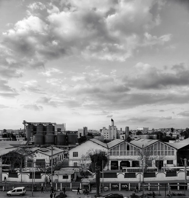 a black and white po of clouds and buildings