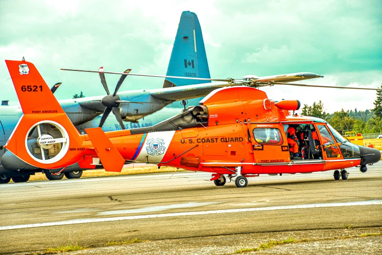 two airplanes next to each other on an airfield