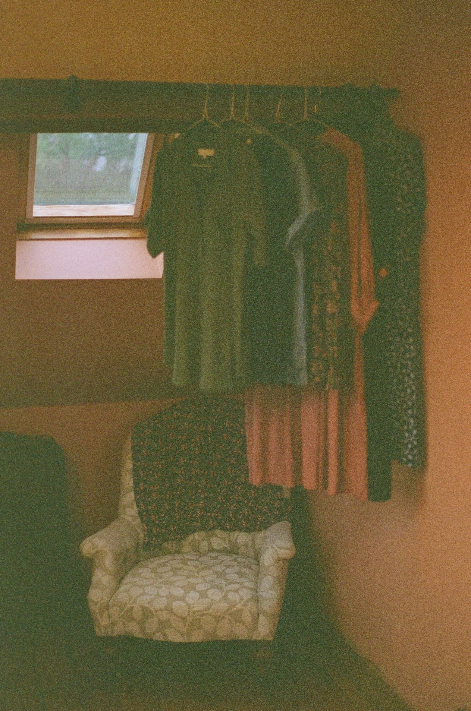 a chair sitting in front of an open closet