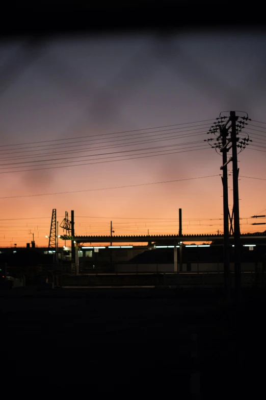 power lines and pylons against a dark sky