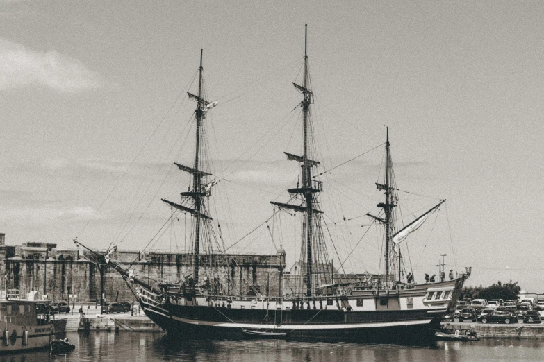 the old style ship is docked in the harbor