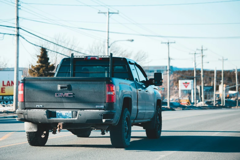 a pickup truck parked on the side of a street