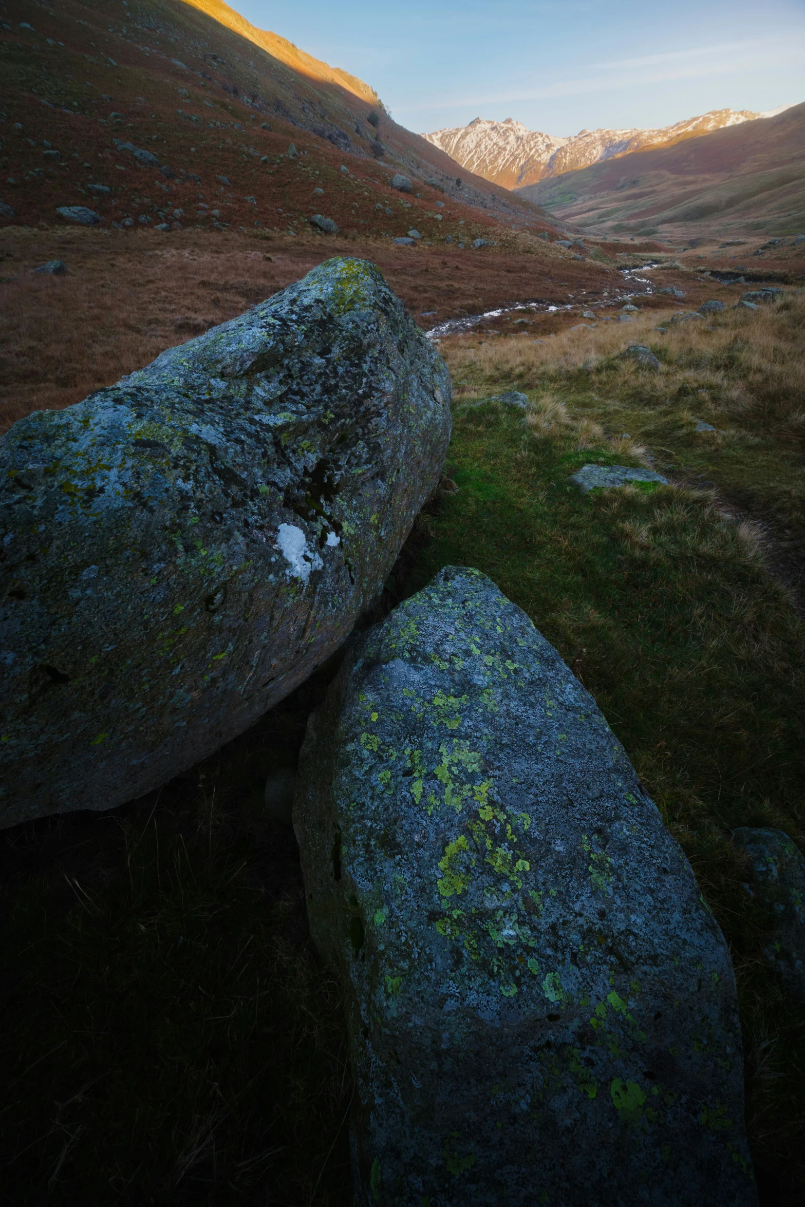 a very big rocky outcropping by a big hill