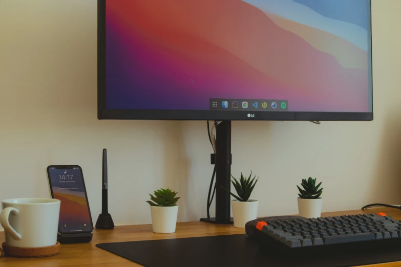 a computer screen with a keyboard and mouse on top of a desk