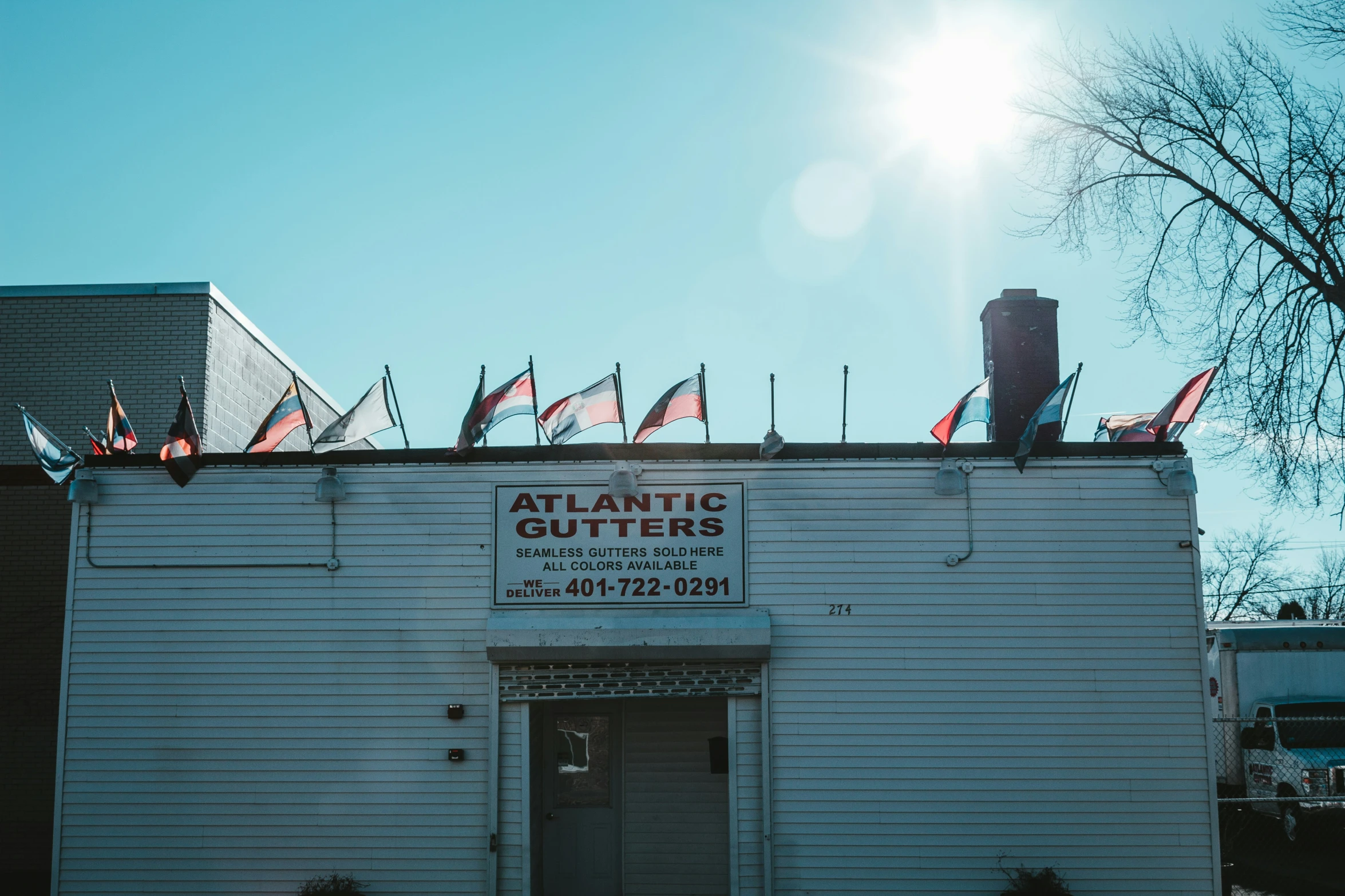 an old restaurant with flags outside of it