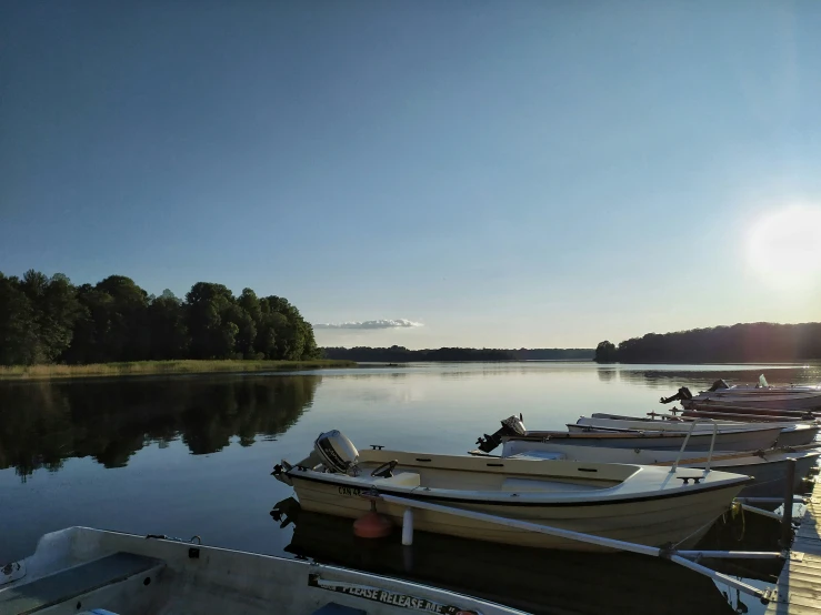 several boats docked on the edge of the water