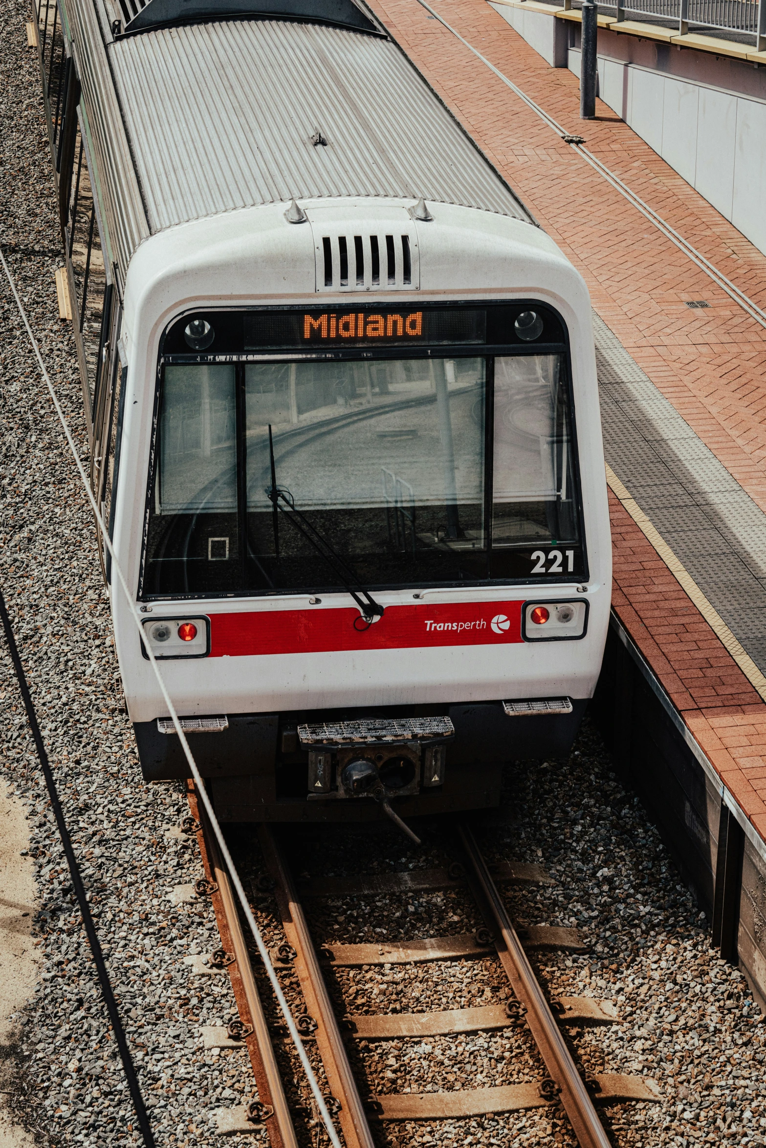 a train sitting on the tracks near some buildings