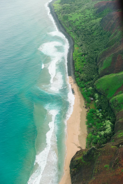 a wide sandy beach near the edge of the ocean