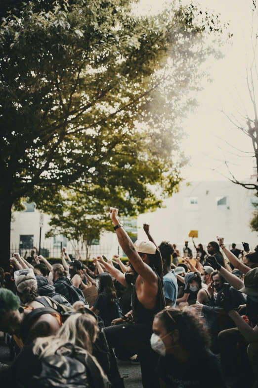 some people are gathered together by the trees