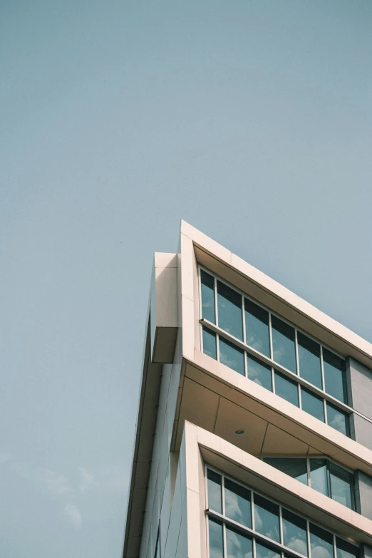 a very tall building with some windows on top