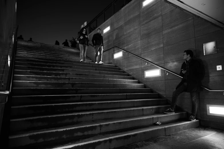 people are coming down the stairs at the top