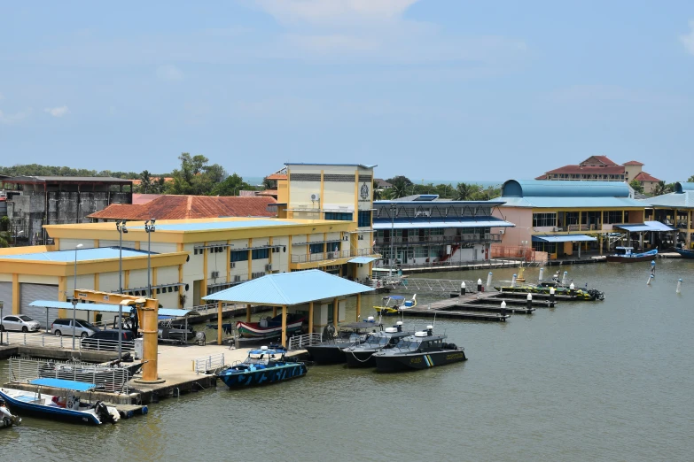 boats in the water and on buildings along a river