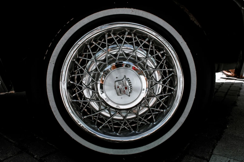 a car wheel from the side view, on a dark background