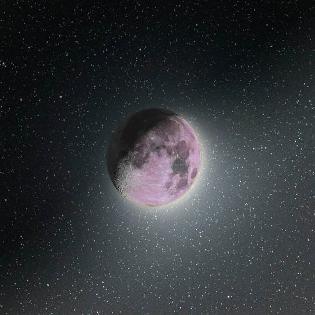 a very large pink moon is in the sky