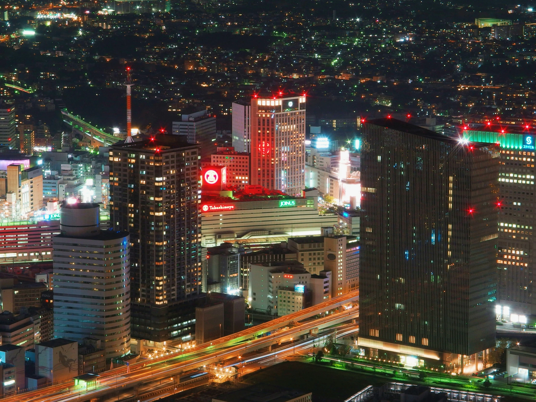 the night city lights and traffic shine brightly