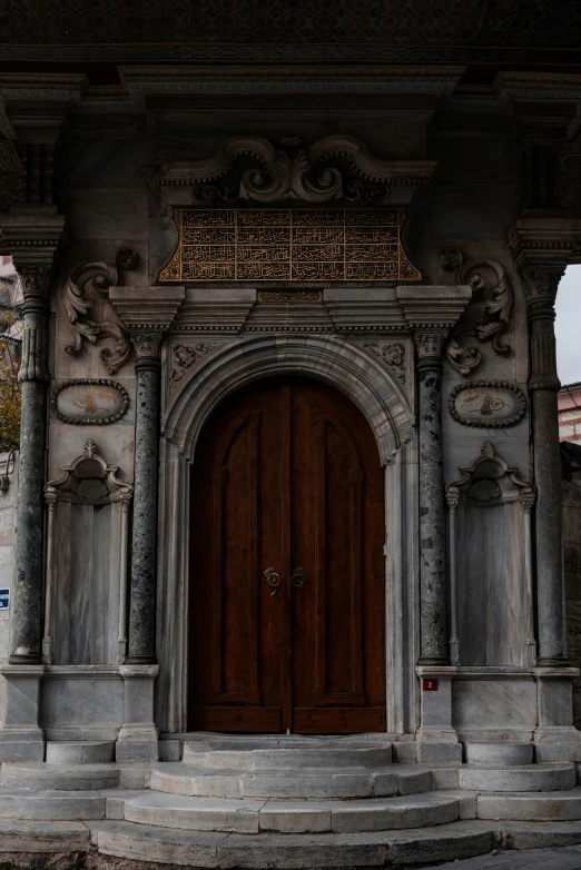 a po of a gothic building with wood door and carvings