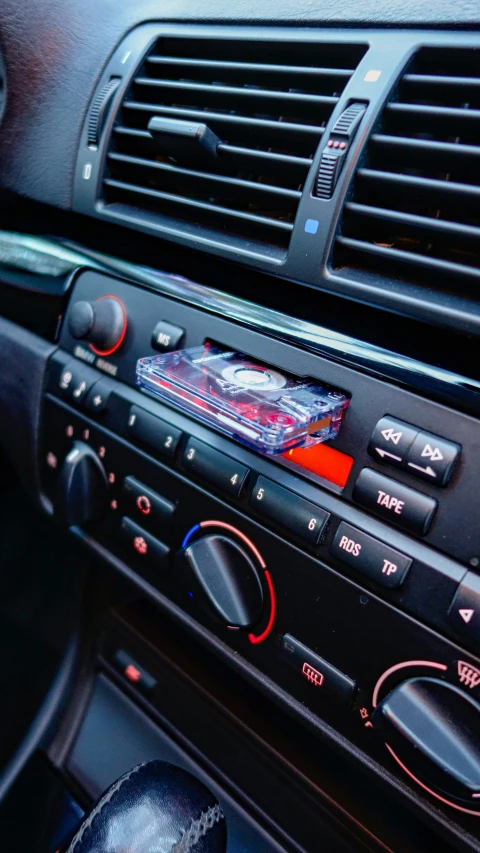 radio on top of a car dashboard with control ons