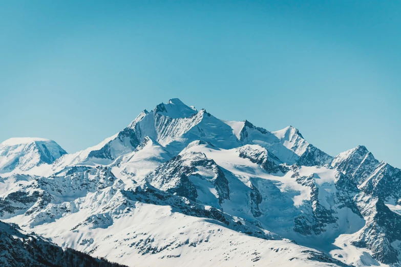 a mountain range with a bright blue sky