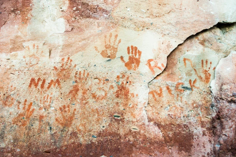 rocks with some hand prints painted on them