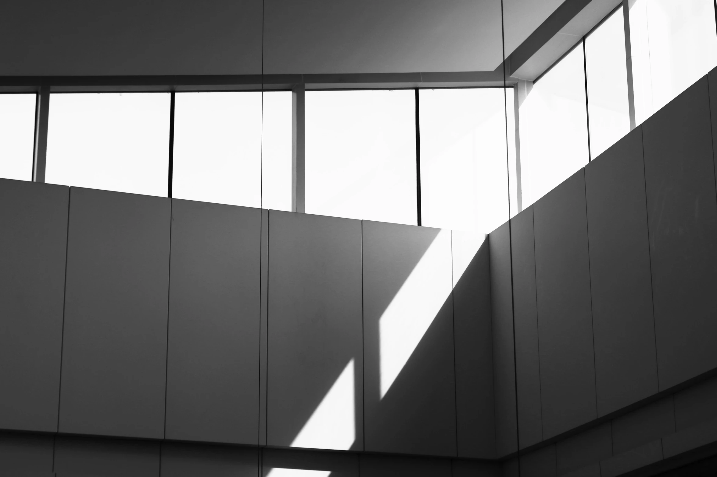 a building's ceiling is shown with lots of light streaming in