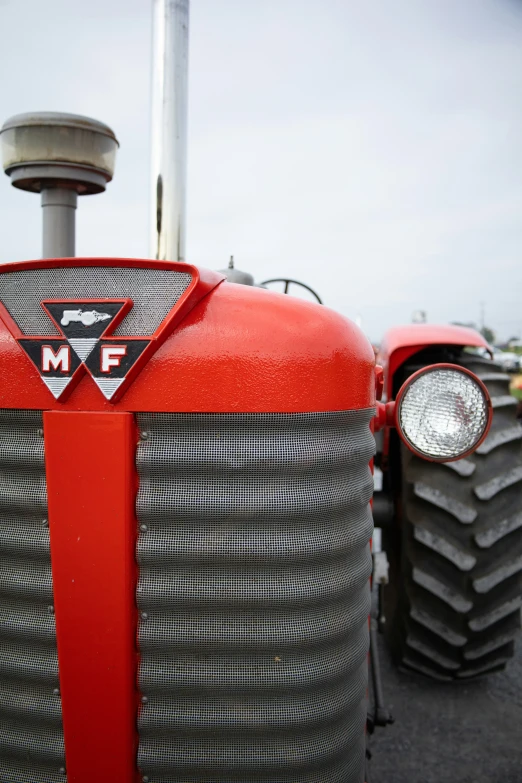 the front of an old farmall tractor that was decorated with metal
