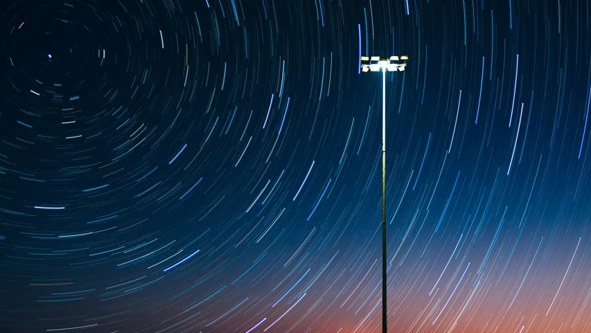 long exposure po of the sky around a lamp post