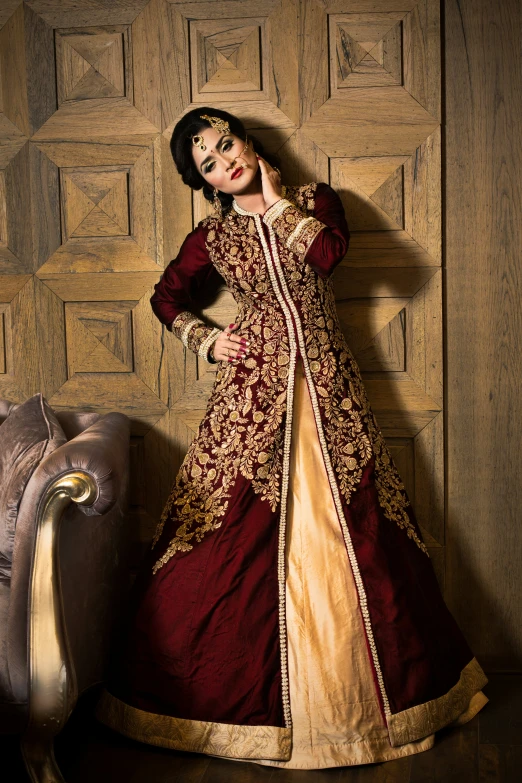 an asian woman in renaissance costume poses for the camera
