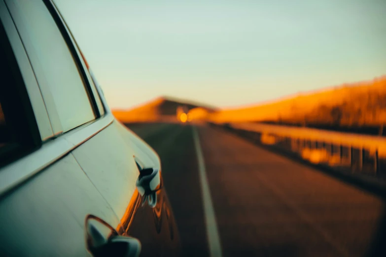 a close up view of the window of a car driving