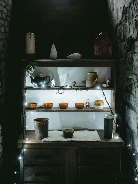 an old fashioned, rustic stove is lit up by led lights