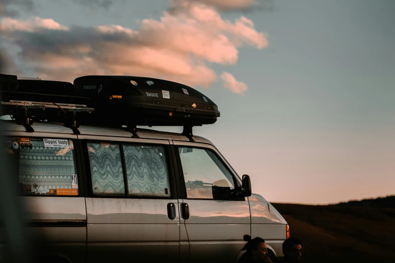 a van with luggage on the top in the desert