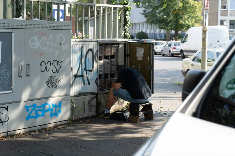 a person with their foot on the ground by some box