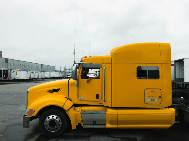 a large semi truck parked in a parking lot