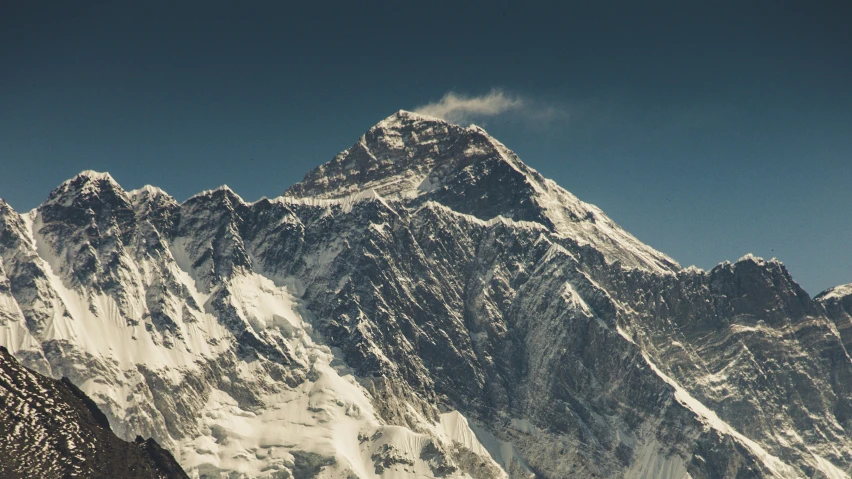 a mountain in the background and blue sky