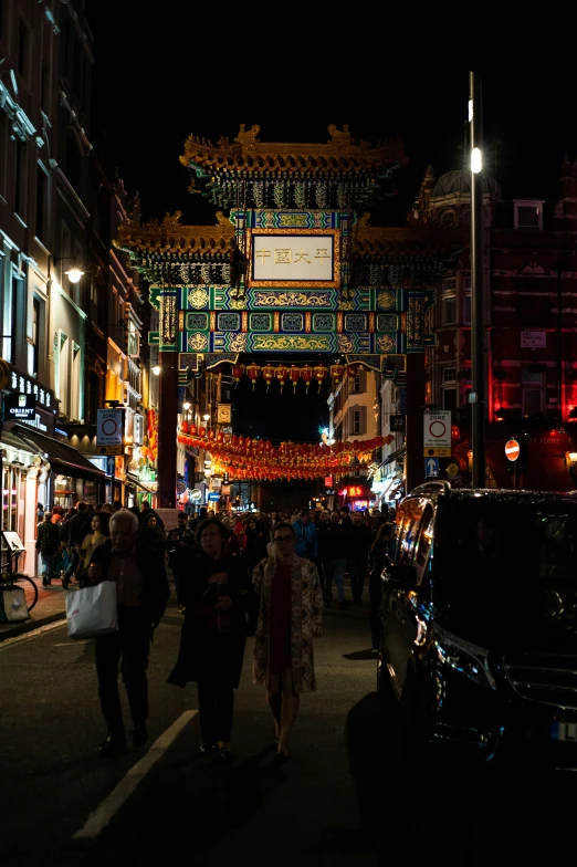 people walking in the streets of an asian town