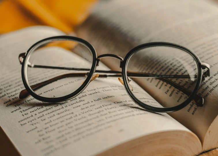 a book that has a pair of reading glasses on it