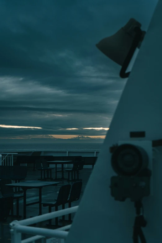 an image of clouds with a telescope pointing toward the ocean