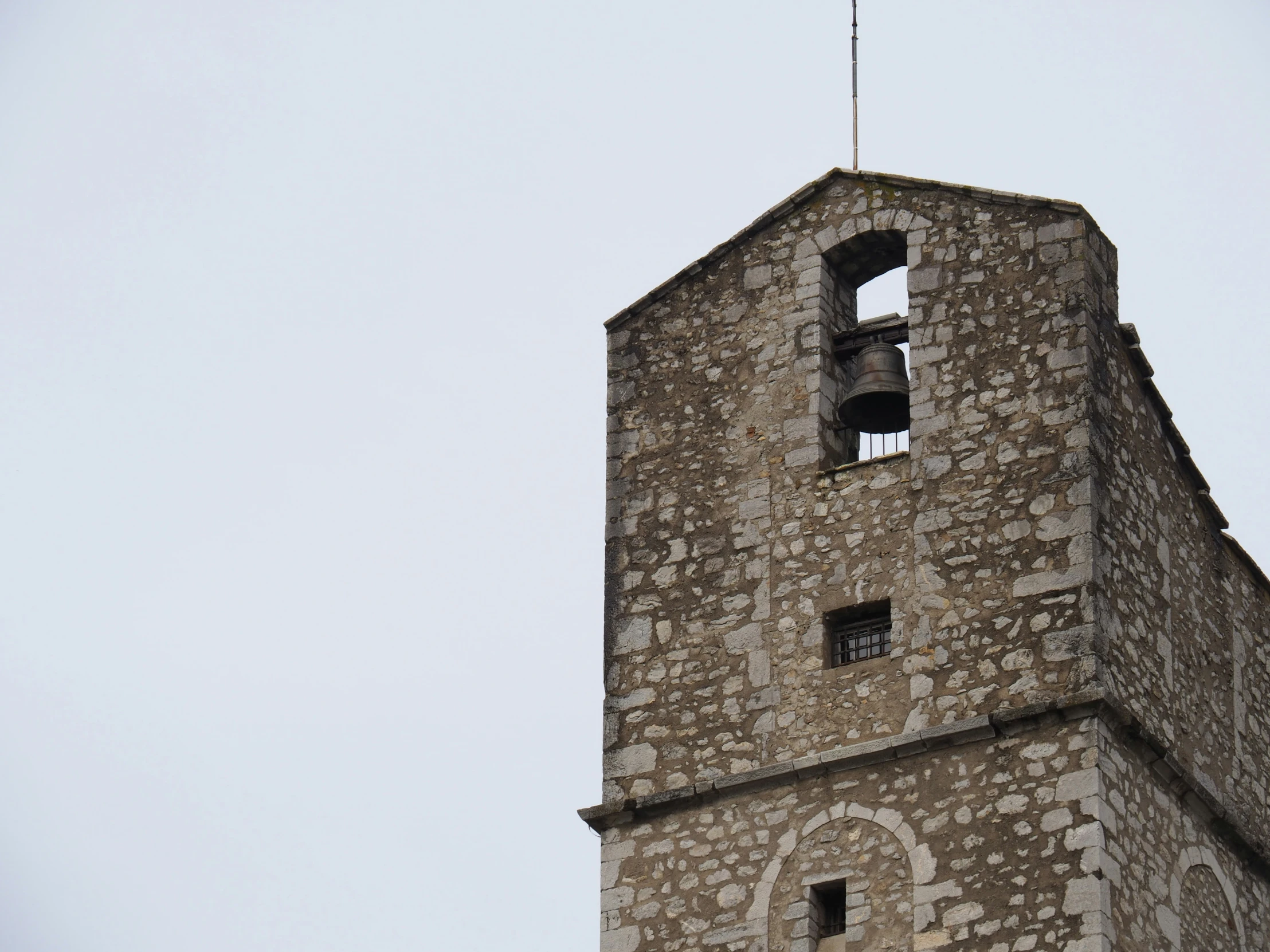 an old tower is shown with a bells on it