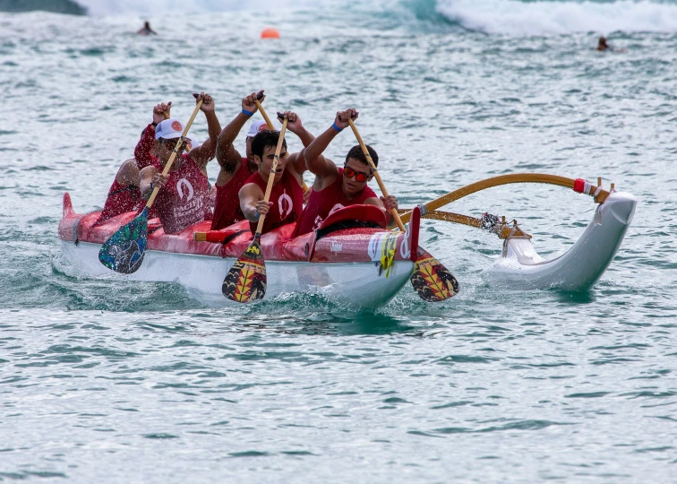 a group of people in a canoe on the water