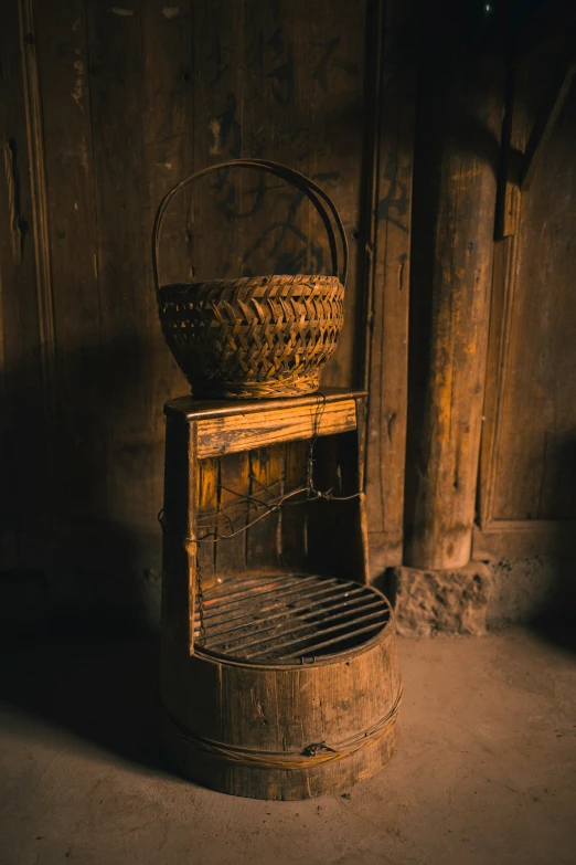 a wooden chair with two baskets on top of it